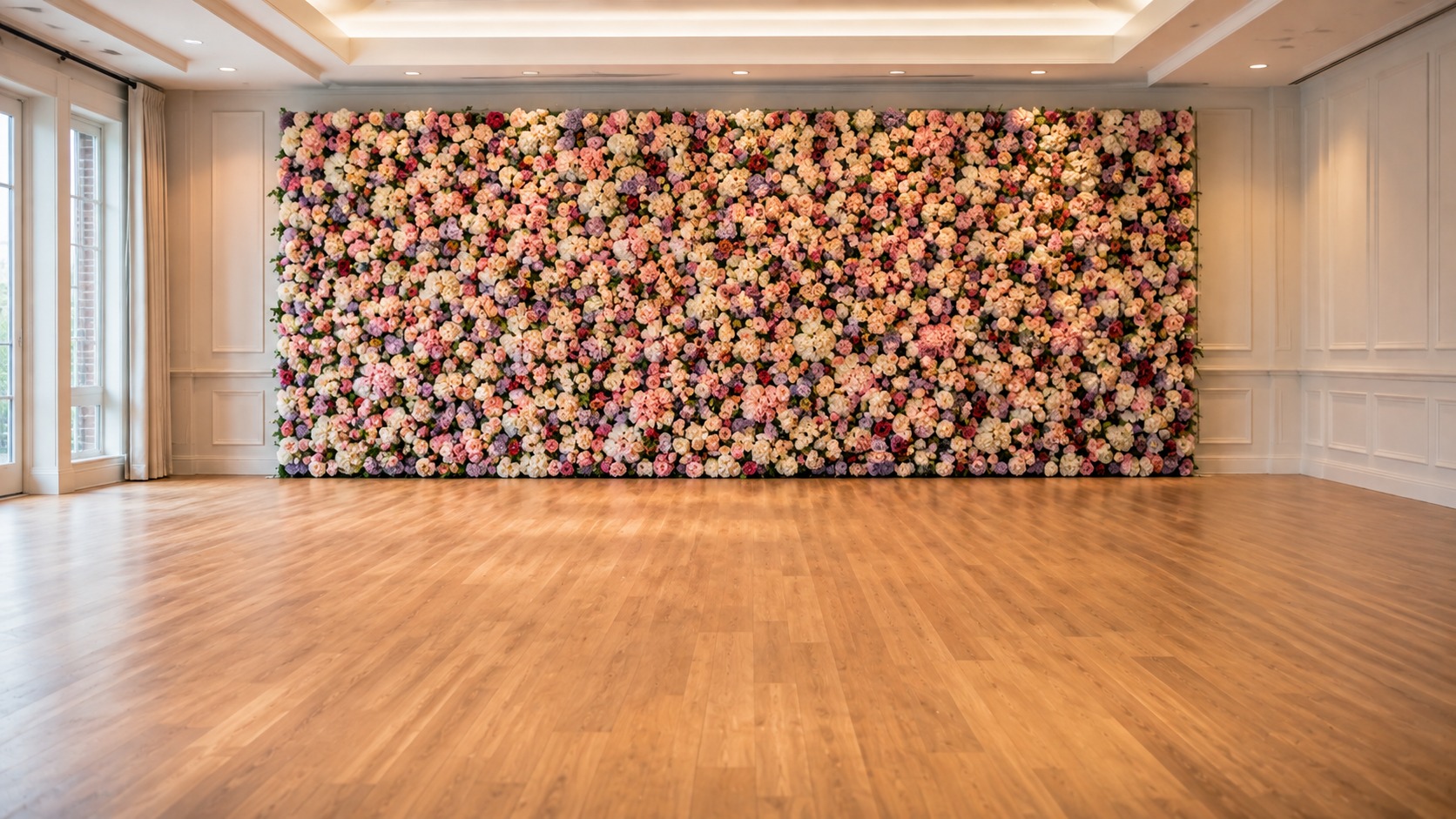 Floral wall backdrop with clear open floor space in front of it for guests to stand