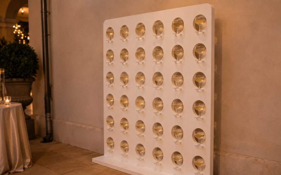Champagne wall filled with glasses standing against a plain wall at a Vaughan reception